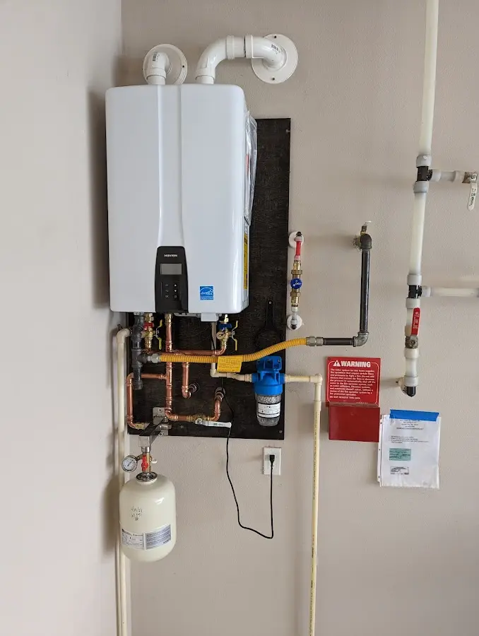 Professional plumber installing copper piping in a Haddon Heights home